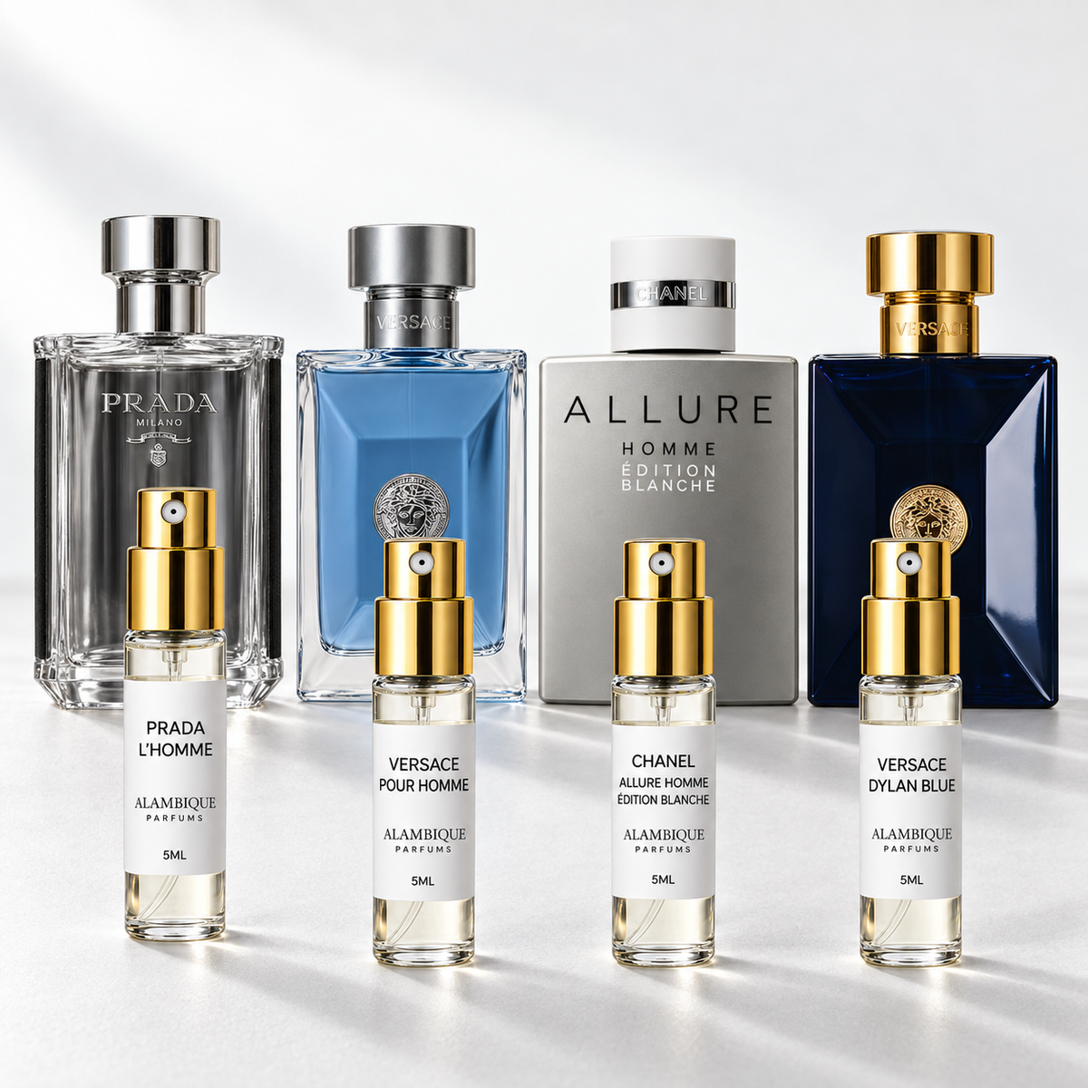 Oficina & Diario Discovery Set: cuatro decants con etiquetas blancas; botellas originales al fondo solo como referencia.